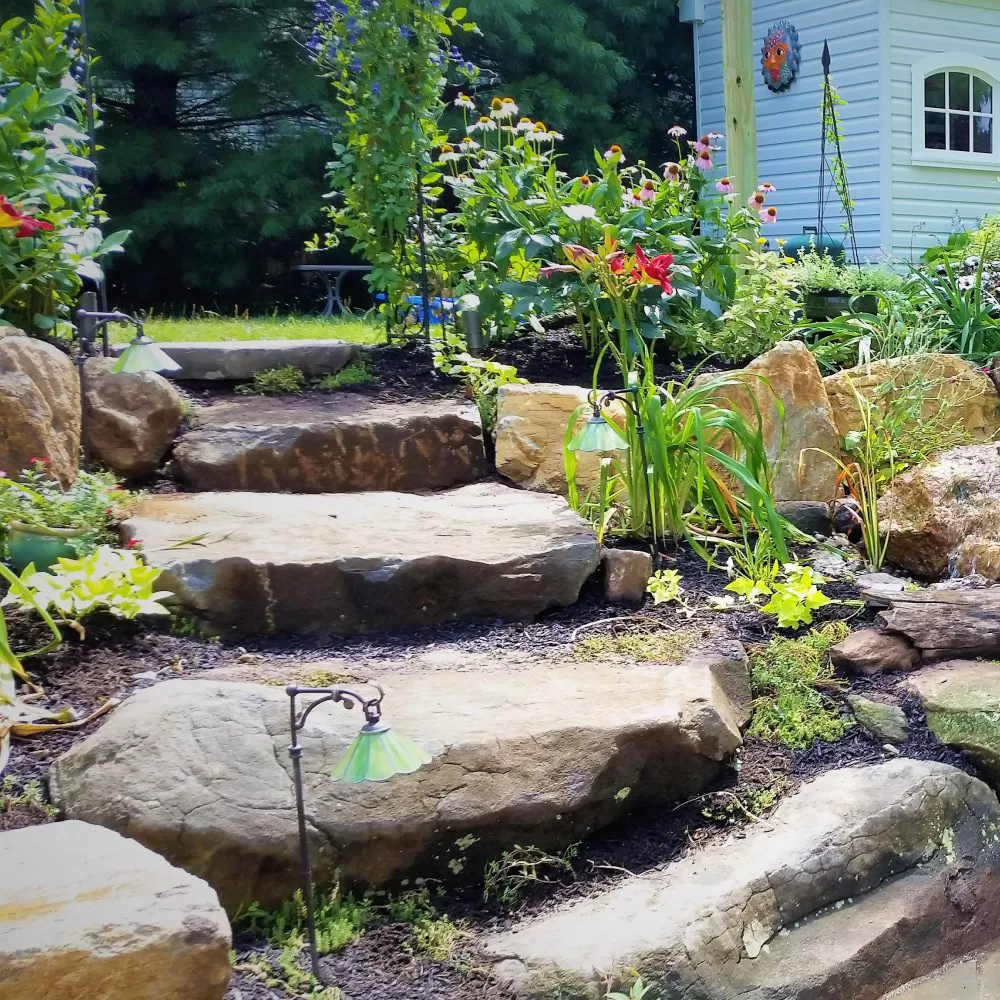 landscape beds with natural stone staircase