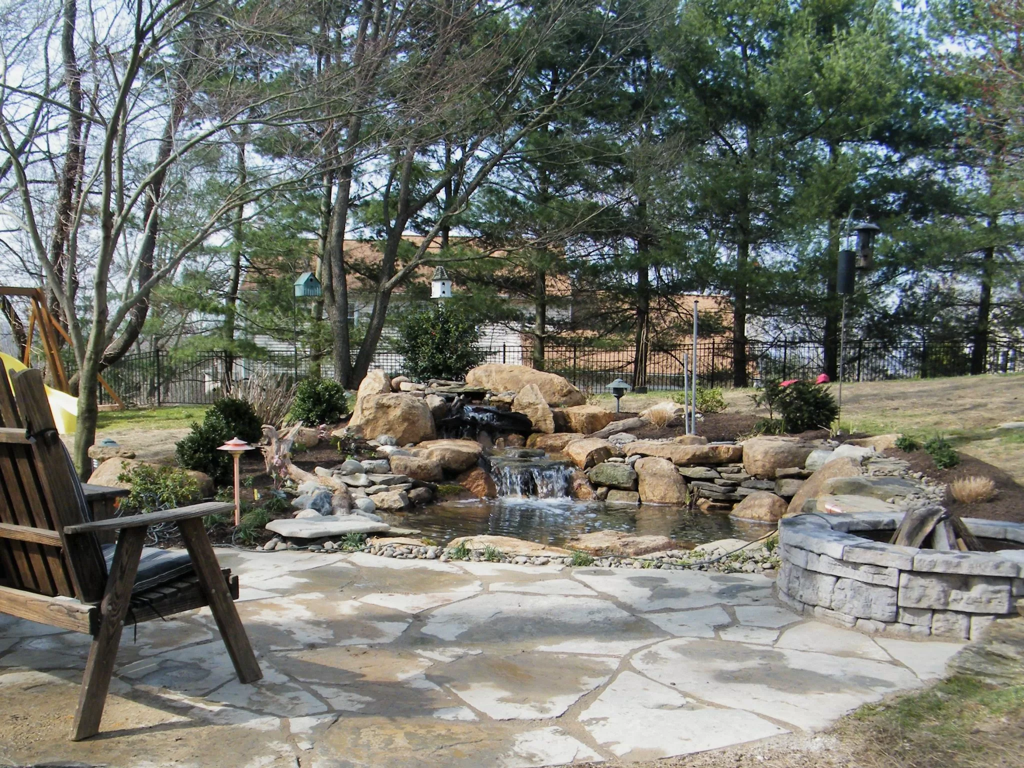 water garden with patio and fire pit